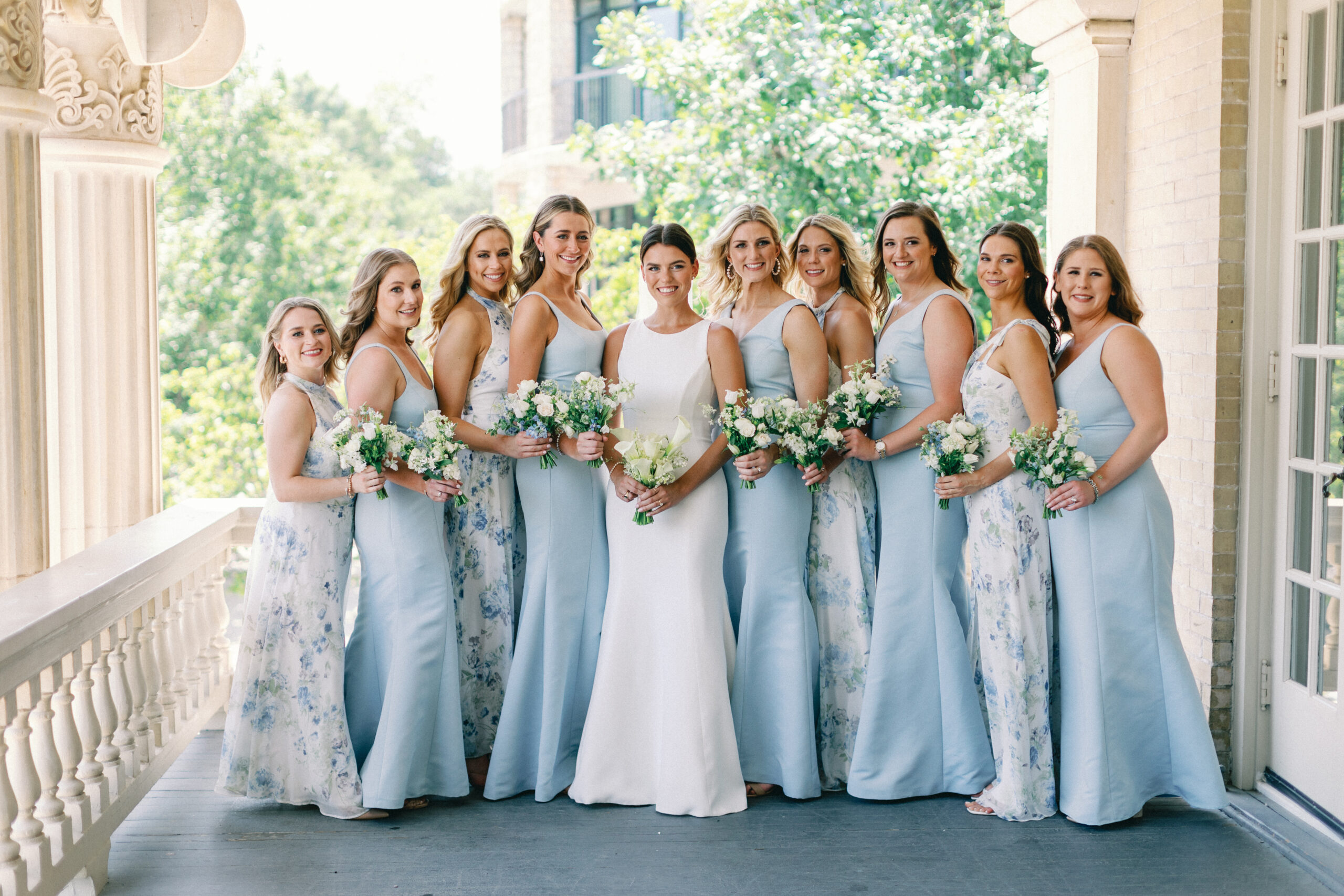 bridesmaids at a hotel ella wedding in beautiful dresses by wedding photographer in austin alyssa nikole 